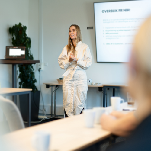 Consultant teaching in a room