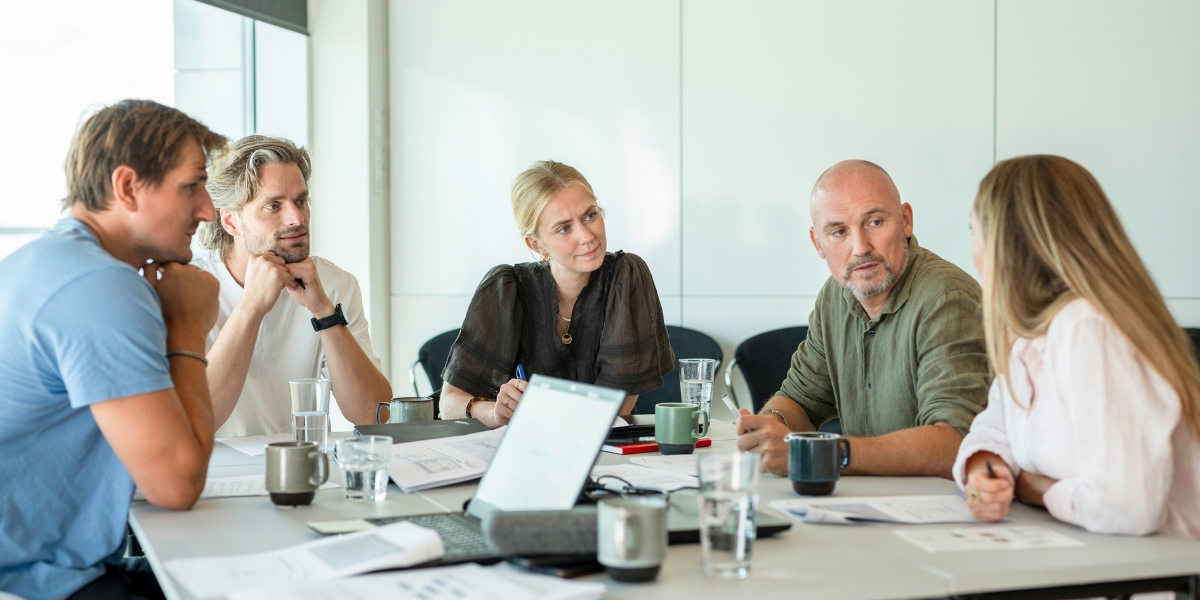 Manager and team talking about changes in the organisation