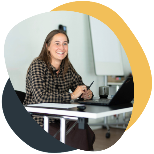 Smiling woman in front of computer